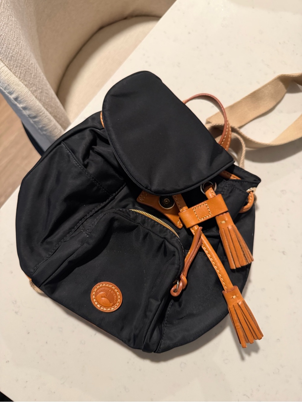Dooney and Bourke black Nylon Backpack with Tan Leather Trim